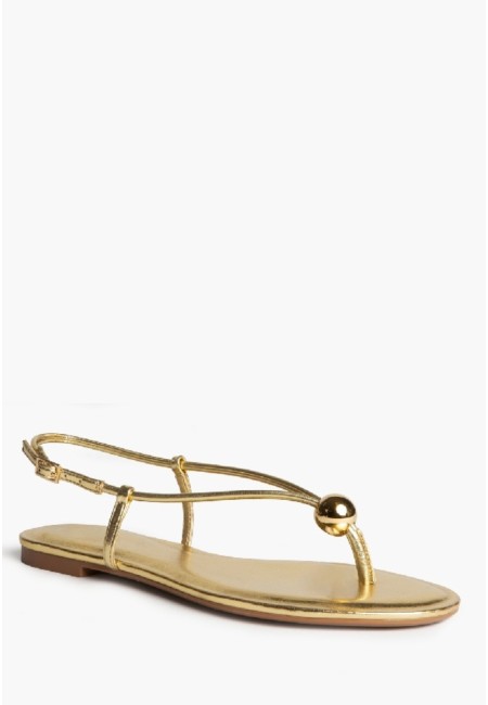 Sandalia plana dorada con tiras finas y hebilla | Bluwer