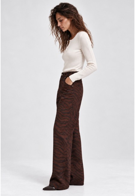 Pantalón vaquero ancho con estampado de cebra marrón | Bluwer